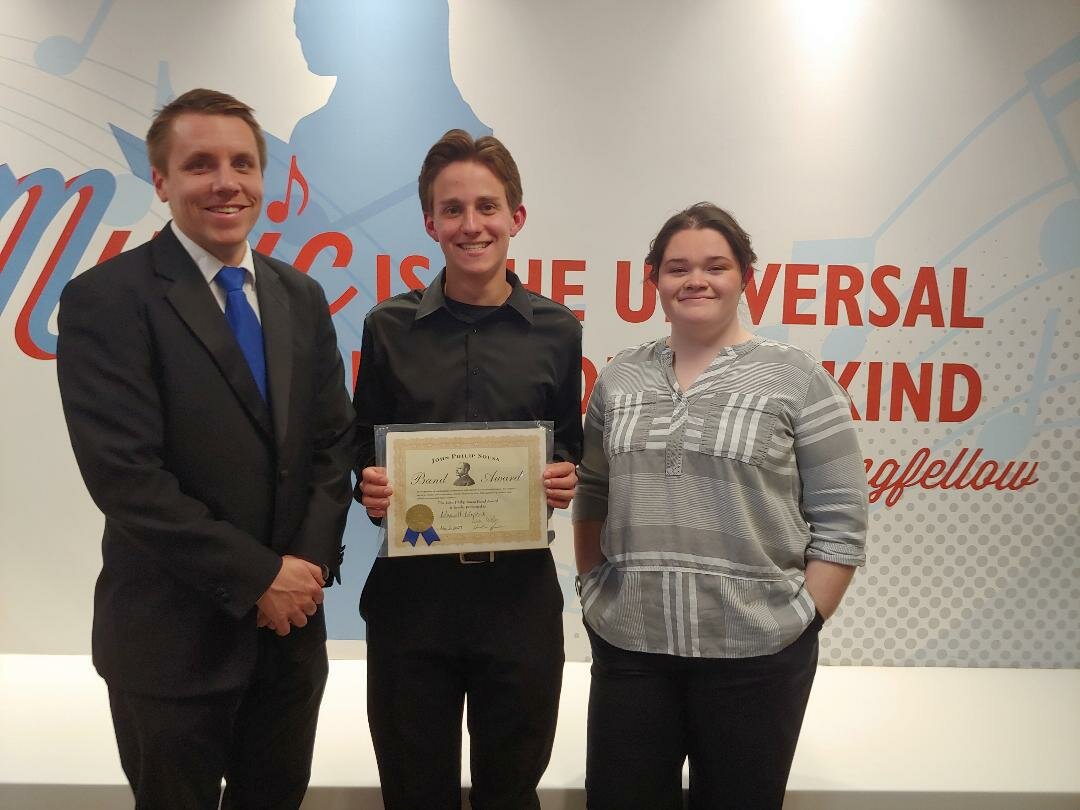 Max Meystrick, center, is the 2023 MHS recipient of the John Philip Sousa Award. The award honors a high school student in marching band for their ‘musicianship, dependability, loyalty and cooperation.” Pictured with Meystrick are band directors Nick Welker, left, and Heather Armstrong, at right. Photo by Janet Morales.