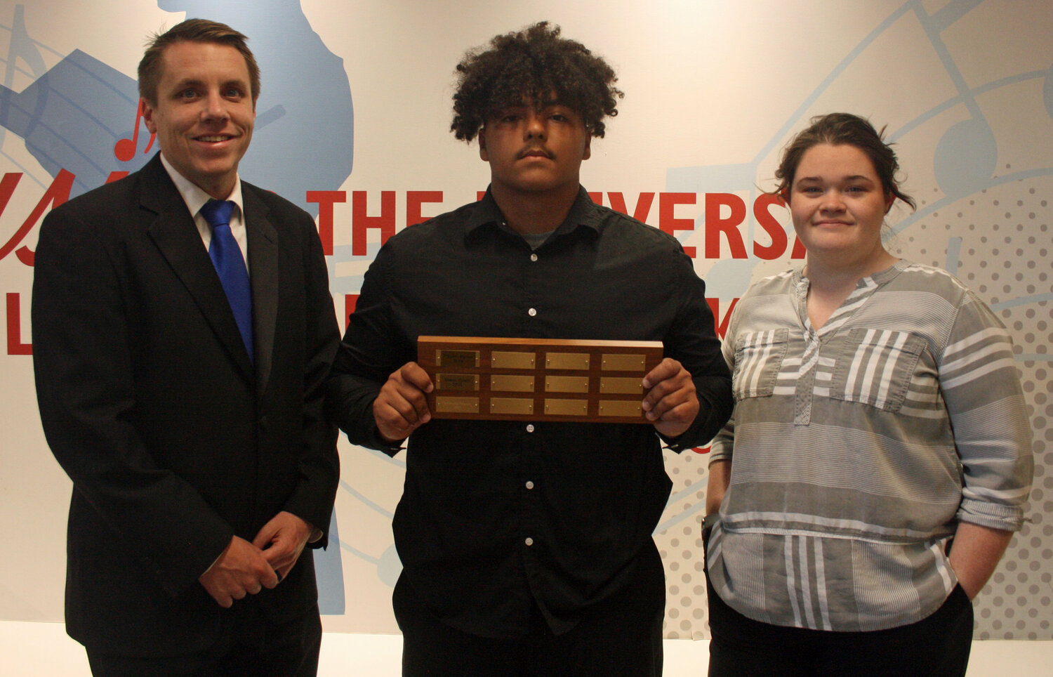 Javaughn Briscoe, center, is the recipient of the 2023 Moberly High School Louis Armstrong Jazz Award. Briscoe is shown with band directors Nick Welker, left, and Heather Armstrong, right. Photo by Janet Morales.