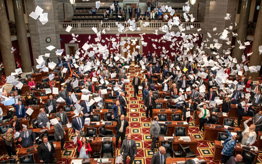 Members of the Missouri House throw paper into the air to celebrate the end of the 2023 legislative session on Friday (Annelise Hanshaw/Missouri Independent).