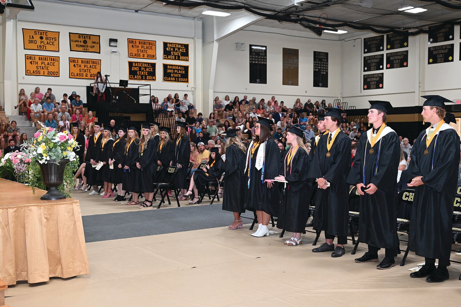 Seniors at Cairo High School stand during the commencement ceremony held on May 14.