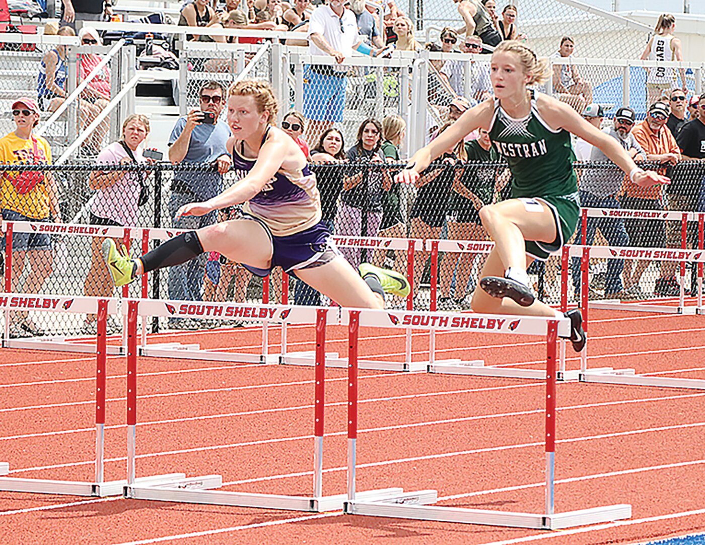 Salisbury's Kate Kottman (left) and Emma Wortmann clear a hurdle during the Class 2 sectional meet at Shelbina on Saturday, May 13.