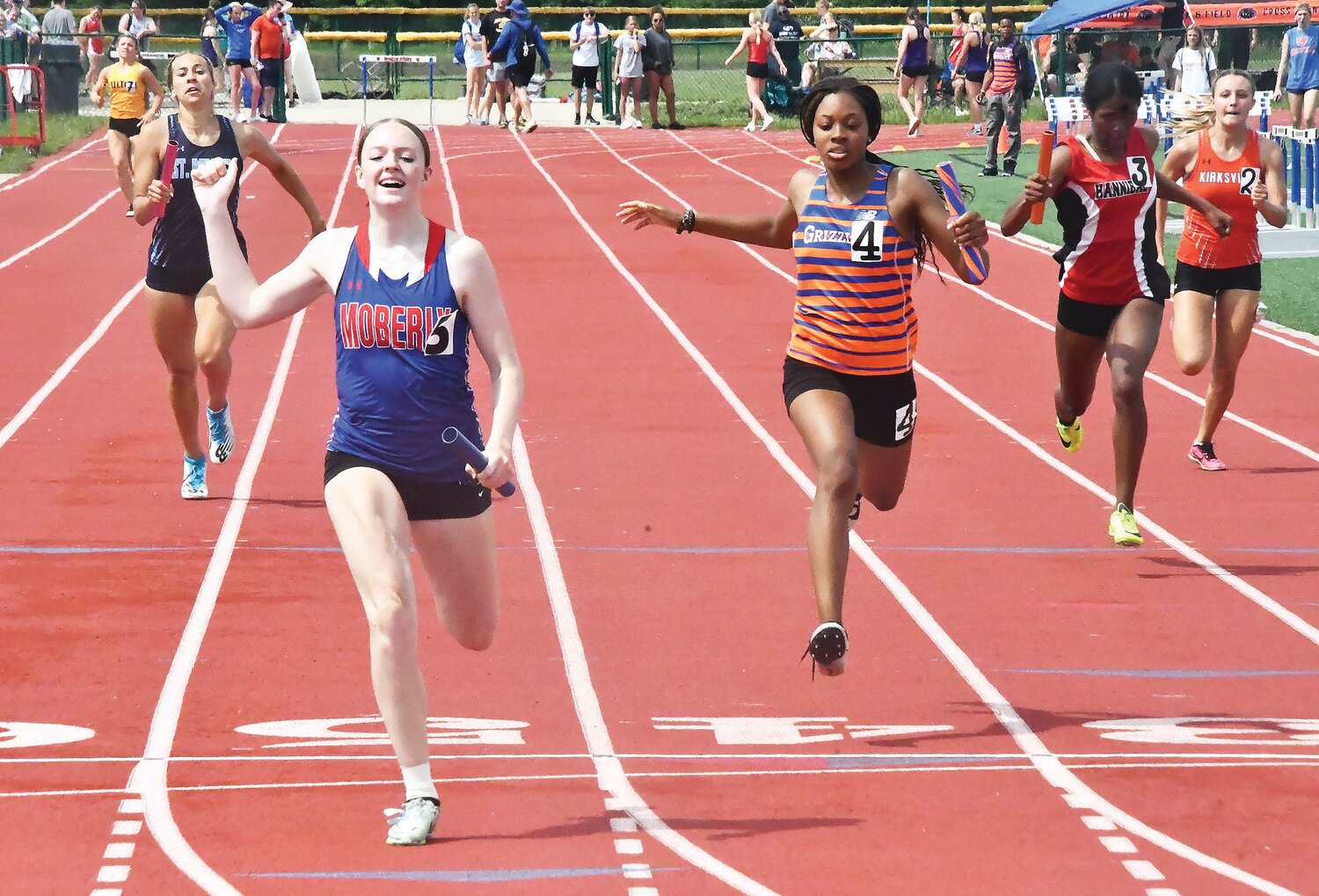 Moberly's Zoey Hannam reacts after the Spartans' 4x200-meter relay team won at the Class 4 District 4 meet on Saturday at North Point High School in Wentzville.