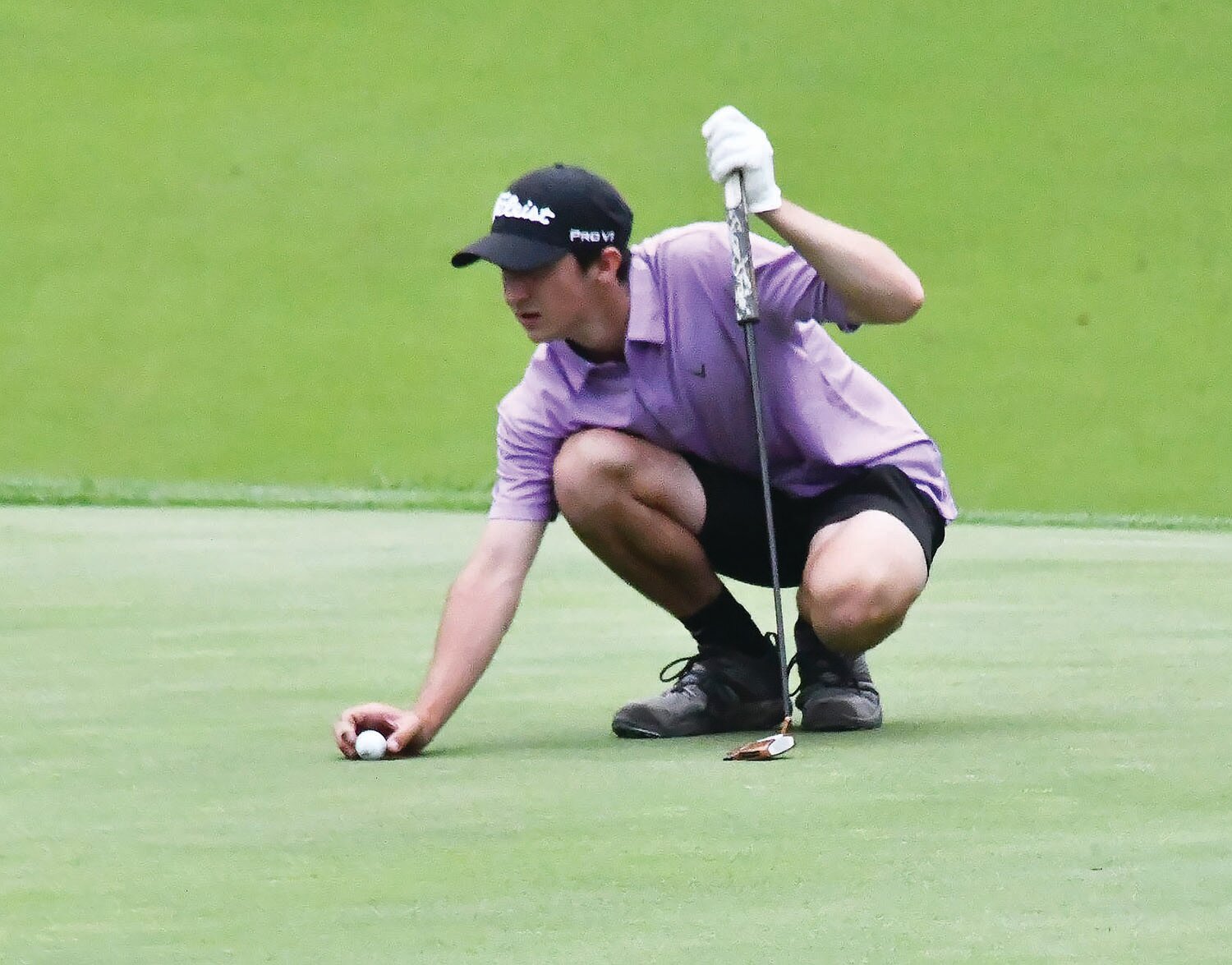 Salisbury's Nolan Gordon (top) addresses his ball on a green during the Class 1 state tournament in Columbia.
