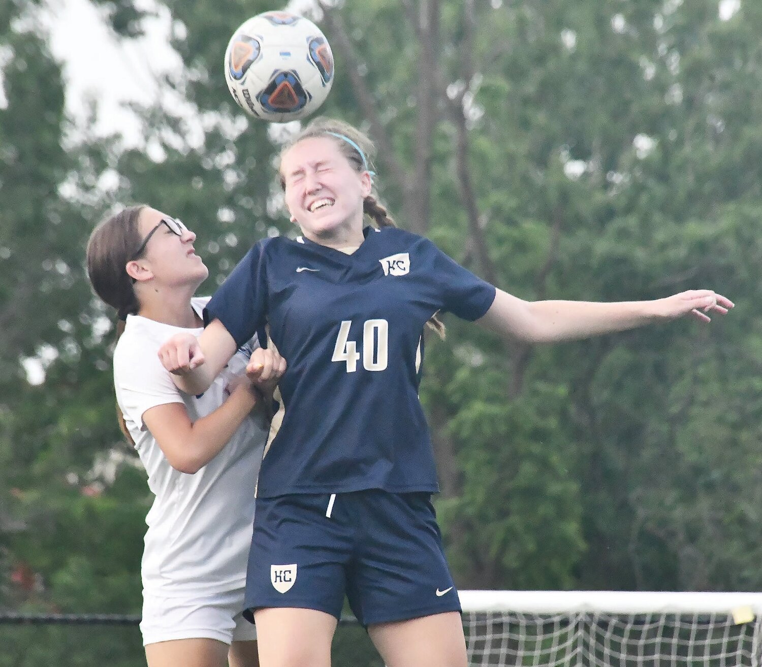 Moberly's Hadley Cleavinger (left) vies for the ball versus Helias Catholic's Brooke Yanskey. The Crusaders whitewashed the Spartans, 7-0.