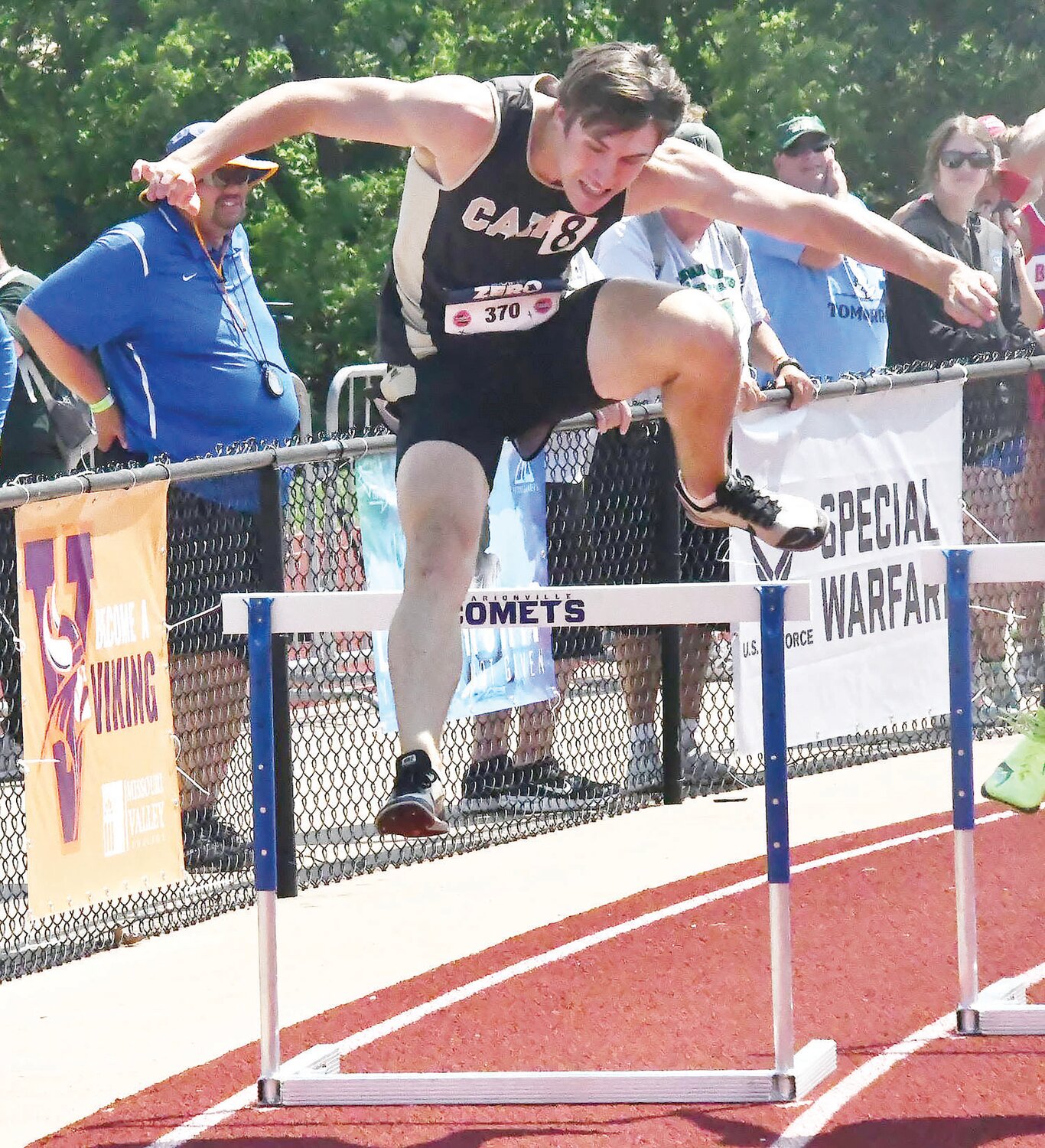Logan Head clears the bar during Saturday's 300-meter hurdles finals at the Class 1 state track and field meet.