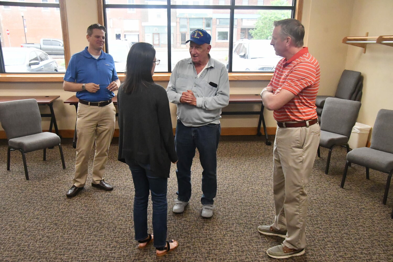 City manager Brian Crane (left), Moberly Public Works director Tom Sanders and Moberly Parks and Recreation Department employee Leslie Keeney talk with Jerry Calvin, who served as Moberly’s first-ever parks director from the 1970s through 1990s. (Photo by Eric Viccaro)