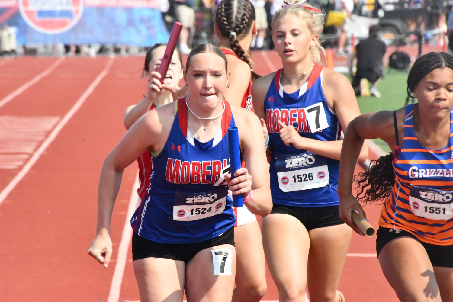 Moberly's Asa Fanning (left) accepts the baton from teammate Bryleigh Knox during the girls Class 4 4x400-meter relay finals at the Missouri State High School Activities Association track and field championships Saturday in Jefferson City. The foursome placed seventh in a time of 4:10.20, after Friday's season-best 4:08.58.