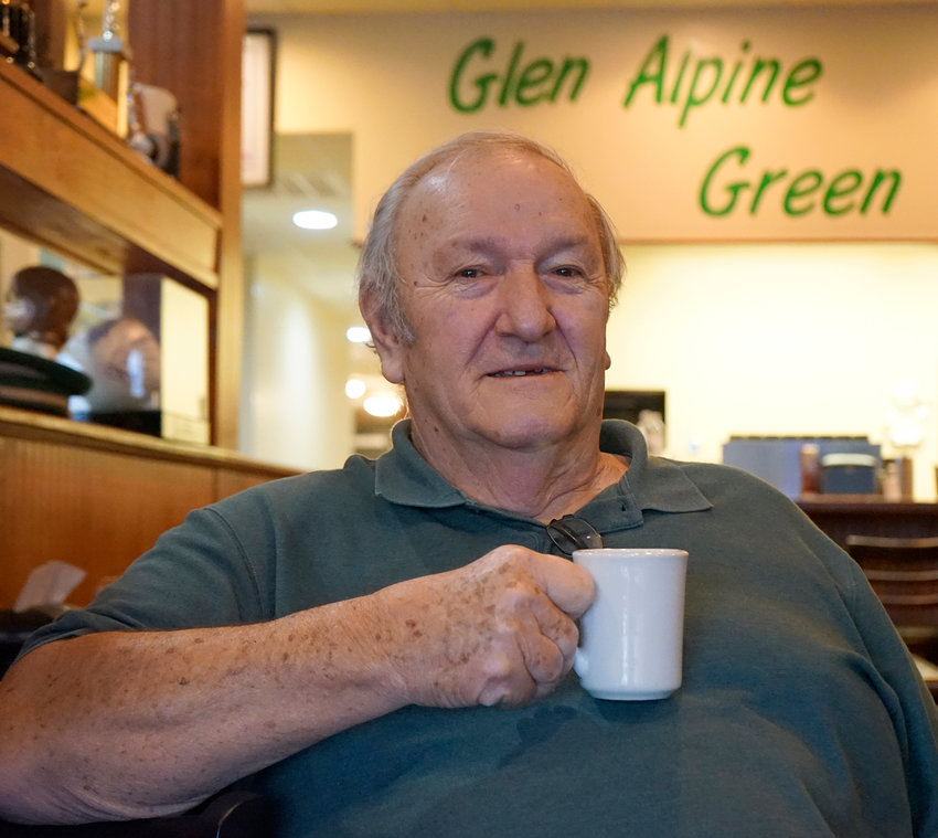 Glen Alpine Mayor Bob Benfield enjoys an early morning cup of coffee at the downtown Green Wave restaurant.