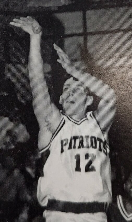 Freedom senior guard Casey Rogers follows through after shooting a jumper in one of the Patriots' boys basketball games during the 1997-98 season.