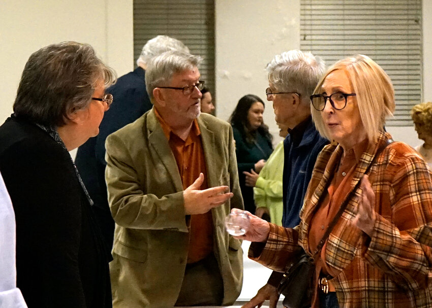 Incumbent mayoral candidate Dennis Anthony (center) and alderman candidate Lora Melott (left) meet with constituents following the Drexel Candidate Forum held on Tuesday, Oct. 24, at the R. O. Huffman Center.