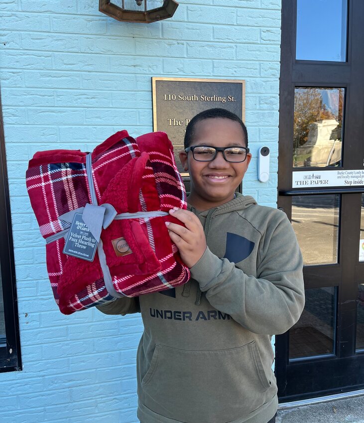 WP Happoldt, a student at Table Rock Middle Schools, collects blankets for the homeless each holiday season.