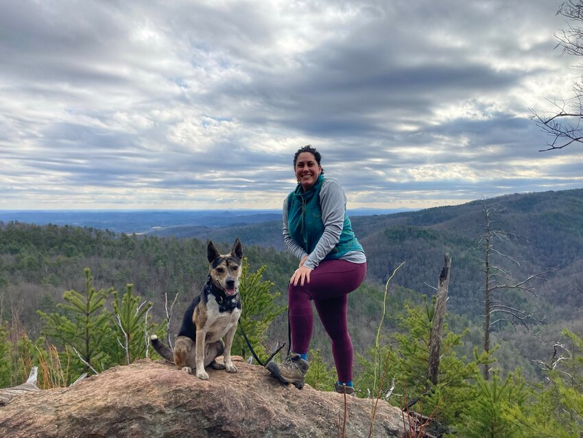 Burke County Trails Specialist Sarah Chabaane hikes in the South Mountains with her step-dog, Niko.