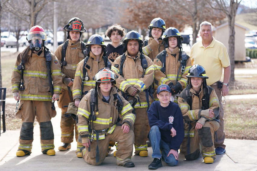 Students in Mike Long's Fire Tech 2 class wear turnout gear and use equipment donated by local fire departments.