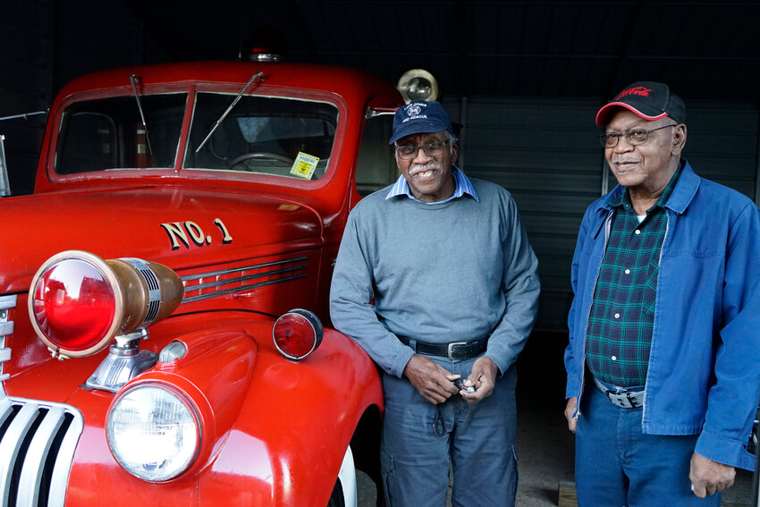 Alex and Kenneth Corpening and the department’s 1942 Chevrolet fire truck at Lake James Fire and Rescue.