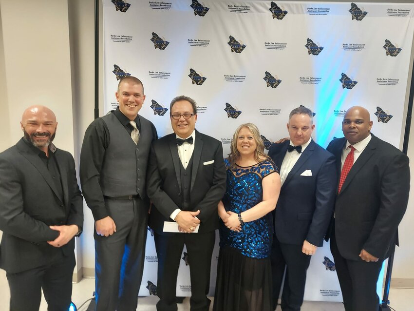 Burke County Sheriff's Office Lt. Jacob Reynolds, Morganton Public Safety Sgt. Anthony Paterno, Jim Toner of Toner Machining Technologies, BCSO Deputy Candace White, MPS Chief Jason Whisnant, and N.C. State High Patrol Sgt. Aaron Johnson gathered together for the first annual Law Enforcement Banquet.