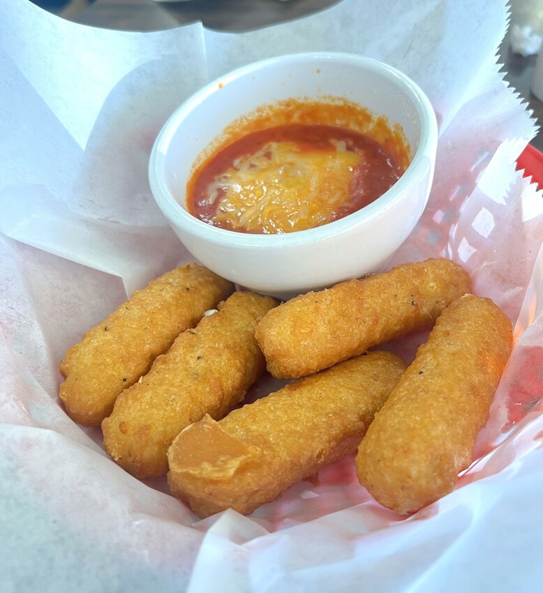 Cheese Stix were served with warm marinara topped with melted cheese.