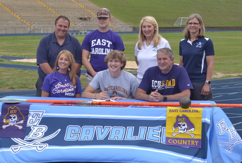 East Burke senior Avery Fraley on Wednesday signed with East Carolina University to compete in track and field. Seated with Fraley are his mother Renee and his father Tommy. Standing (from left to right) are EBHS track coach Joshua Martin, Fraley's brother Trevor, EBHS principal Katie Moore, and EBHS track coach Heather Ramsey.