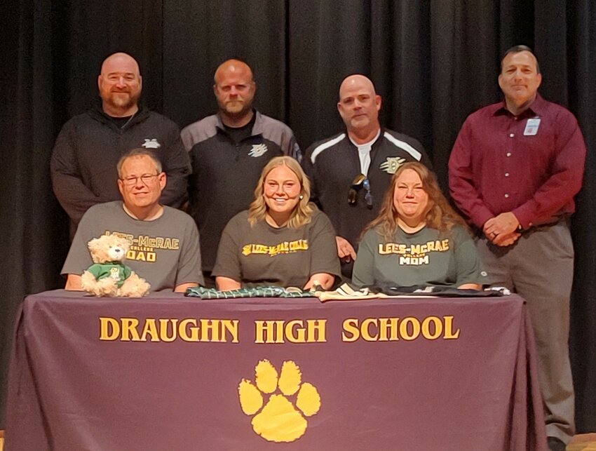 Draughn senior Katie Hamm on Thursday signed with Lees-McRae College for softball. Seated with Hamm are her father, David Hamm, and mother, Angie Hamm. Standing (from left to right) are Draughn head coach Chris Powell, Draughn assistant coach and Hamm's travel coach Robbie Crouch, former Draughn coach Chris Cozort, and Draughn athletic director Eric Shehan.