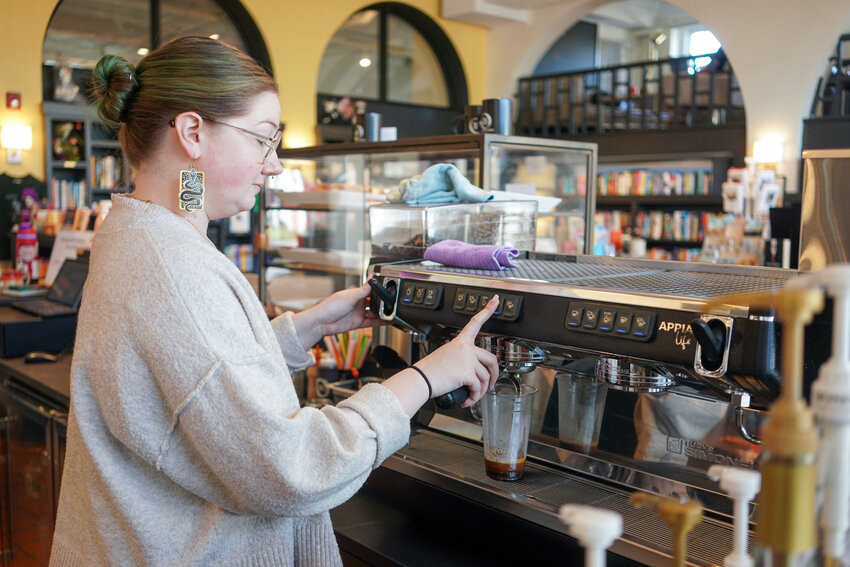 Sara Debnam brews coffee at Thornwell Books in downtown Morganton.