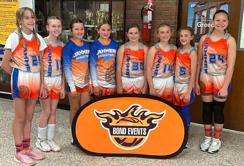 Both the fifth and sixth grade Burke Jammers youth girls travel basketball teams won their age division titles at the Bond Events D2-D3 Hoopfest in Winston-Salem on April 13. The sixth grade team included (from left to right) Ava McFalls, Emery Tompkins, Kyleigh Wingate, Abigail Garcia, Taylor Parker, Aubrie Holloway, and Kenlee Wilson and was coached by (back row left and right) Sydney and Presley Haas.