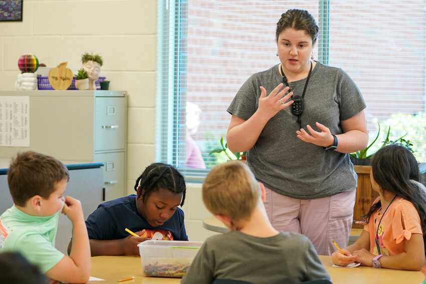 Beginning Teacher of the Year Cassidy Upton, who teaches art at Mountain View Elementary School, engages with her students.