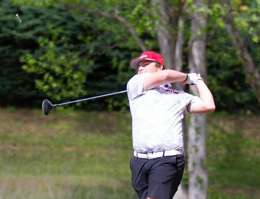 Freedom's Alex Bock watches his drive on the par 5 12th hole at Silver Creek Golf Club during Wednesday's Burke County championship event. Bock shot a 2-under par 70 for his second straight county title (and seventh win this season) as the Patriots also repeated as team champions.