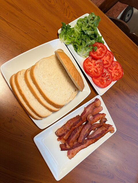 Sourdough bread, crisp thin bacon and fresh lettuce and tomatoes combine for the perfect BLT.