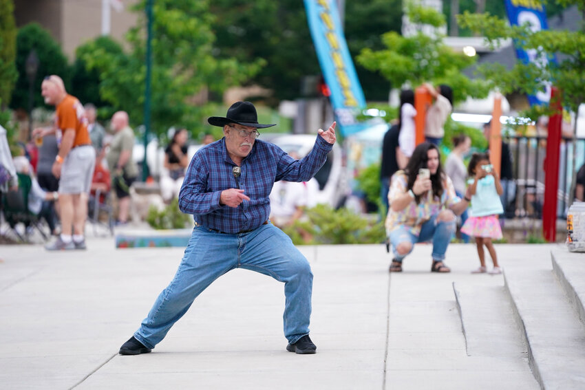Wade Childers strikes a pose as he dances to the sounds of Soul Watt on May 3 at the TGIF concert in Morganton.