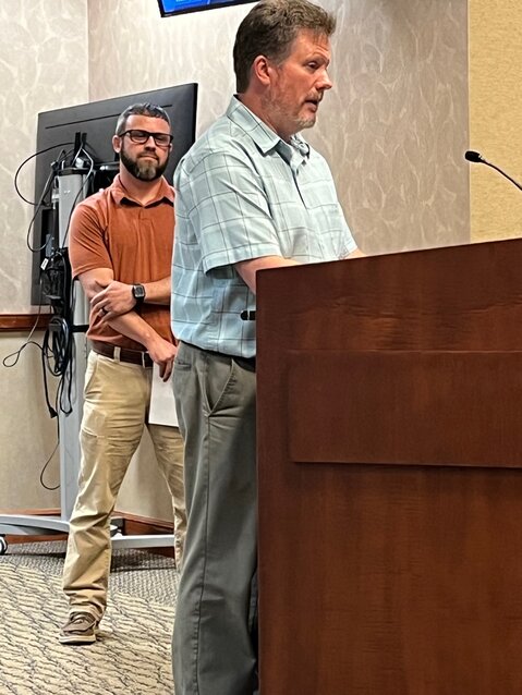Morganton Water Resources Director Brad Boris speaks to city council while Public Works Director Michael Chapman looks on during Monday's meeting. The council proclaimed May 19-25 National Public Works Week.