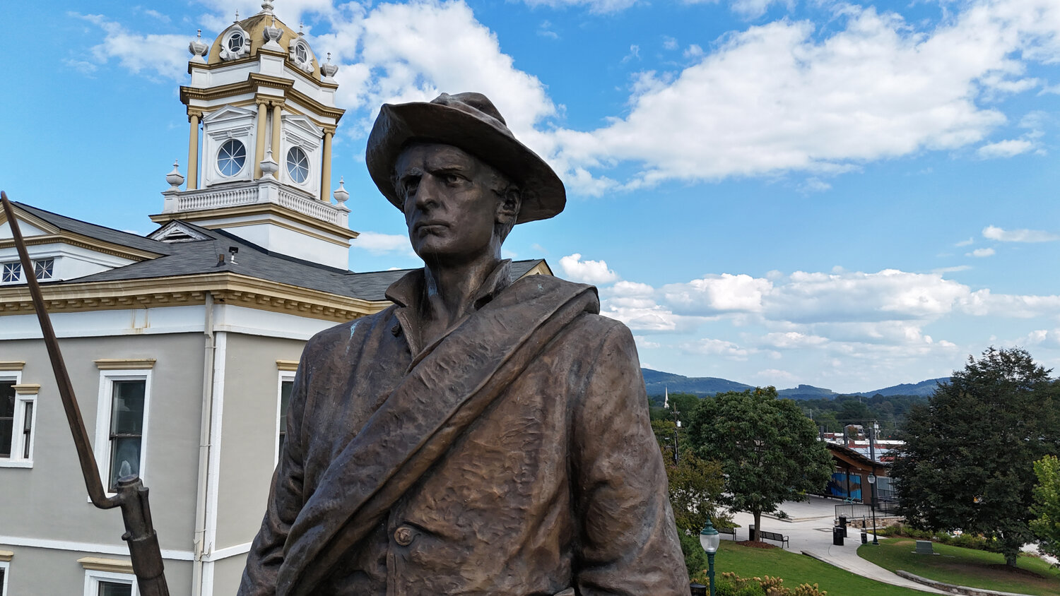 The face of the Confederate soldier who has stood watch over downtown Morganton on the Historic Courthouse Square for more than a century.