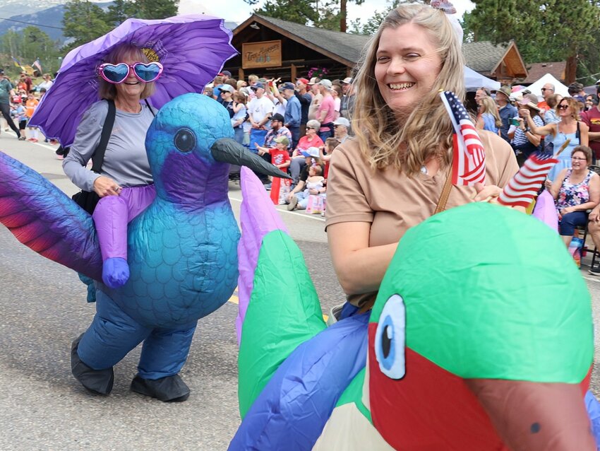 Colorful hummingbird costumes add some fun to the Fourth of July parade.