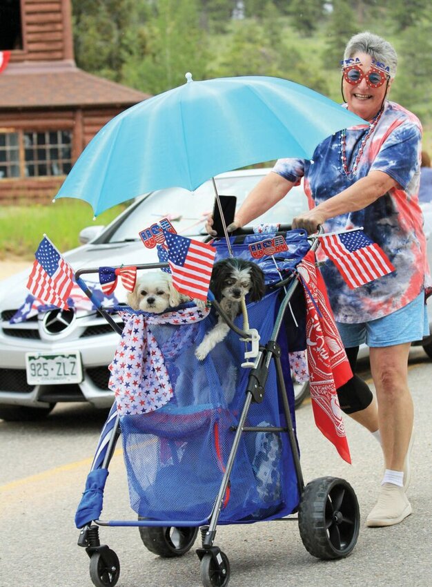 Celebrating in small towns Adorable puppies partake in the Allenspark parade, inspiring spectators to grin from ear to ear. PHOTOS BY OMAYRA ACEVEDO