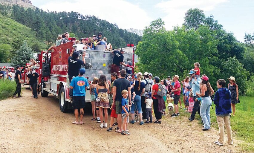 Celebrating 4th of July in Jamesstown Kids climb onto the Jamestown fire truck to participate in the Independence Day Parade at Jamestown. PHOTOS BY KIRK C. WATKINS