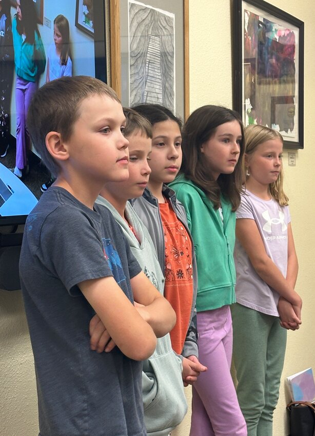 Listening intently: 
Fifth grade student council members (Caden McLain, Jace Parten, Catherine Motchan, Catherine Pirkle, and Blakeley Parten) conversing with school board members.