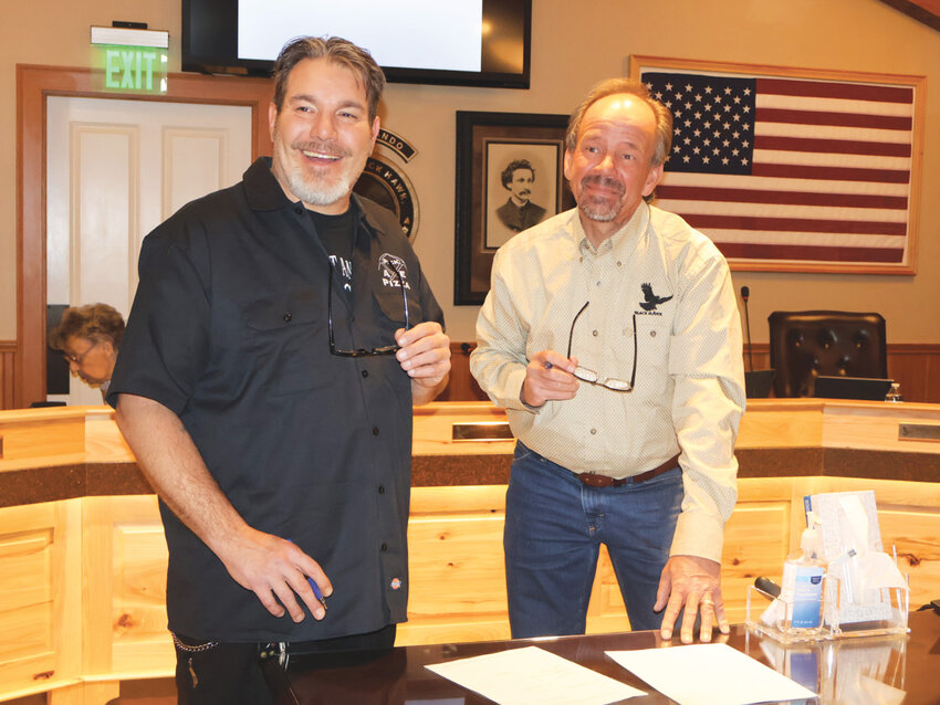 Sealing the deal for the Copper KitchenBruce Boynton (left) and Mayor David D. Spellman (right) finalize the lease agreement which ends in 2030.