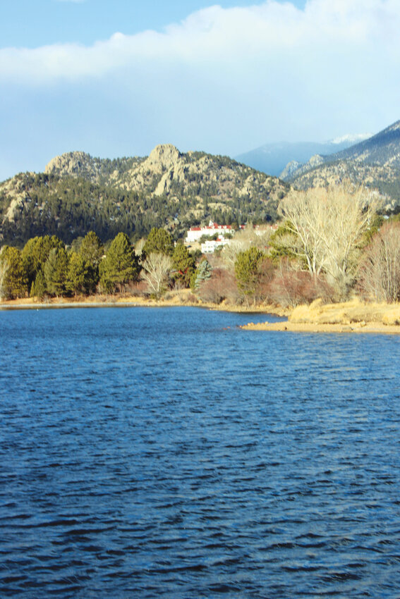 Hidden charmThe Historic Stanley Hotel peeks through the greenery around Lake Estes, adding to the area's beauty.