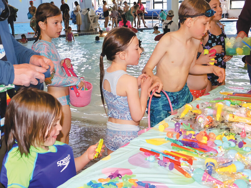 Choosing treasuresKids browsed the prize table after their egg hunt adventure.