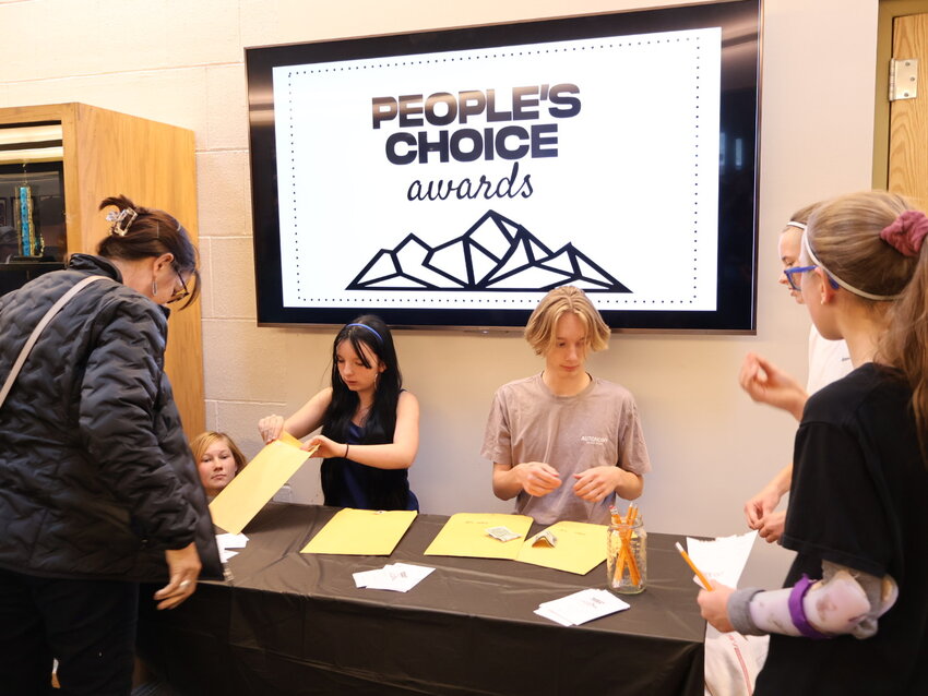 People’s ChoiceVolunteers gather community votes for the People’s Choice Award, where guests paid $1 to vote for their favorite student artwork.