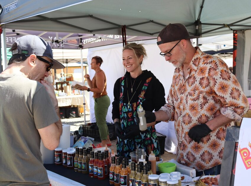 Serving the heatBurning Bridges offered up some spicy samples of their unique hot sauce blends.