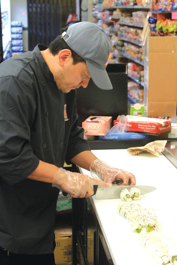 A master sushi chefPau Khual preparing one of his delicious creations.