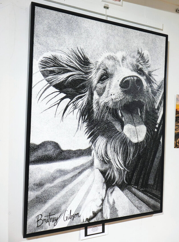Pure joy in oil paint penBritney Gibson’s “Joy Ride,” drawn entirely in stipple technique, captures the wind-in-your-fur bliss of a pup on the road. The piece earned an Honorable Mention in the 2D category.