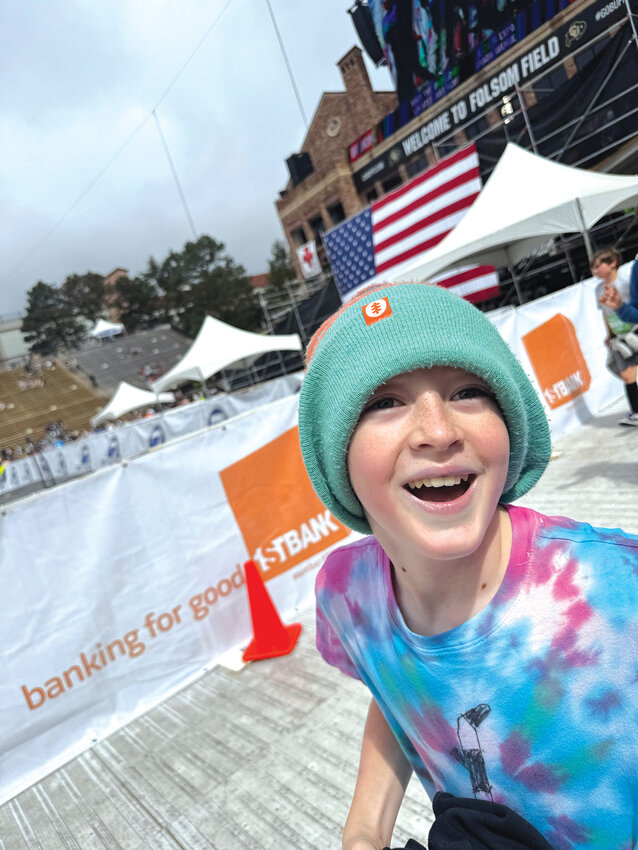 His first BOLDERBoulderNederland middle schooler Evan Troy enters into Folsom Field as he finishes up his first BOLDERBoulder race.