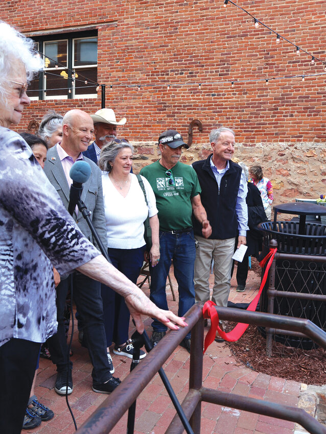 Ribbon momentMembers of City Council, the Belvidere Foundation, and Gilpin County Commissioners gather for the ceremonial ribbon cutting at the entrance of the newly restored Shoofly courtyard.