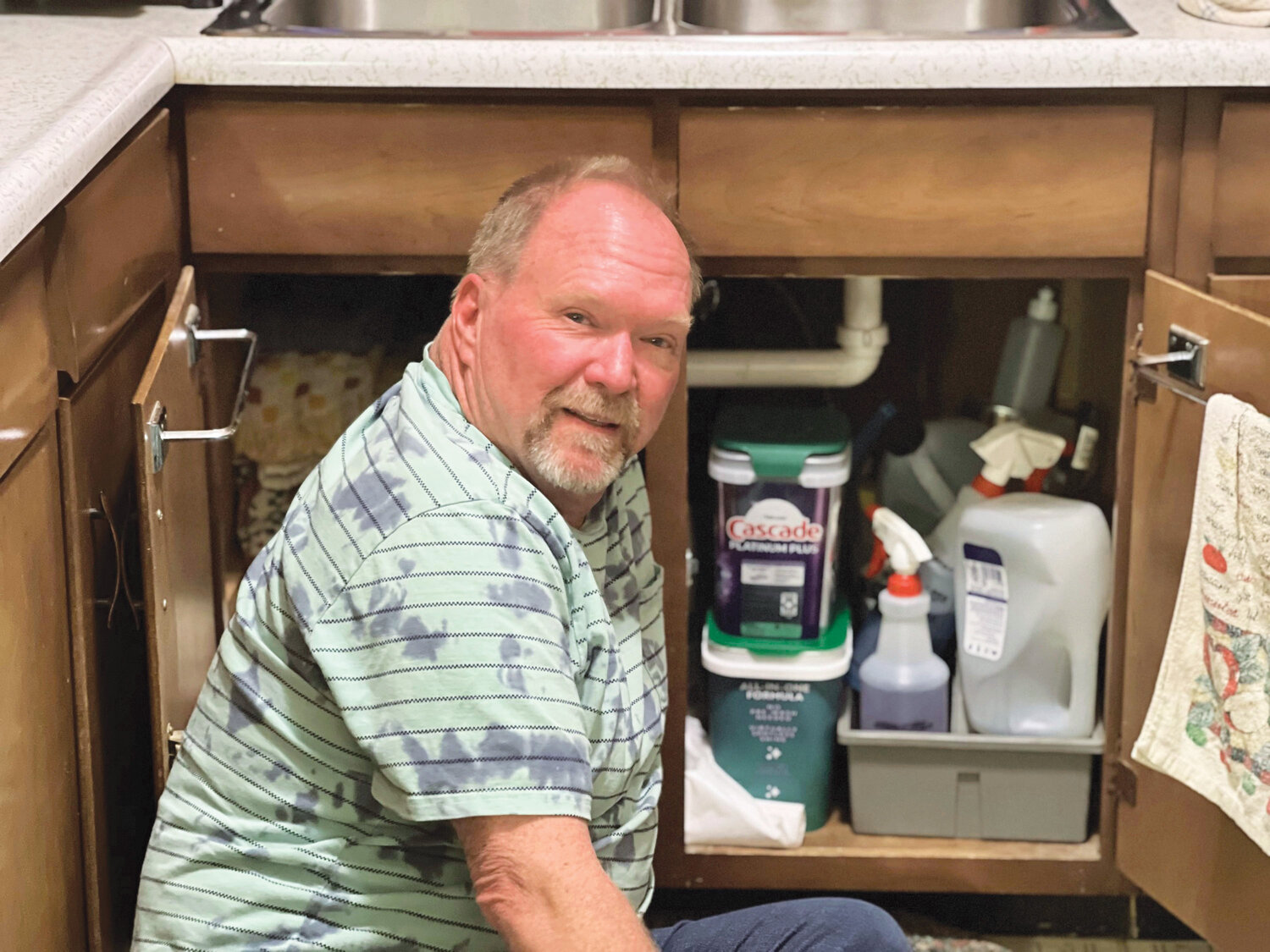 More than handySteve Olson poses for a moment between plumbing and electrical work.