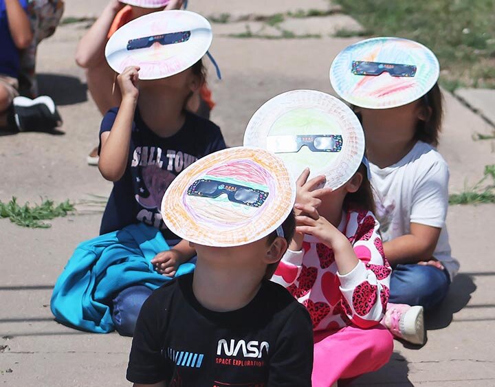 ECLIPSE EYEWITNESSES
Eldorado kindergartner Landon Hester wore his NASA shirt to school on Monday for the solar eclipse. He was joined  on the playground by classmates Harper Bybee, Jazmine Garcia and Kamila Gonzales as they donned their decorated safety glasses to view the eclipse. KATHY MANKIN | THE ELDORADO SUCCESS