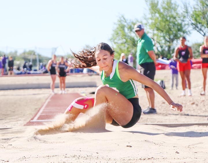 GOING TO STATE FOR 4TH TIME -- Logan Prater, shown here competing in Sonora, claimed gold in the Long Jump and the Triple Jump a the Region 1-2A Track Meet in Canyon last weekend. She will compete in the two events at the UIL State Track Meet on Friday, May 3rd. It will her fourth consecutive appearance in the big show. -- ANGIE BRYANT | THE DEVIL’S RIVER NEWS