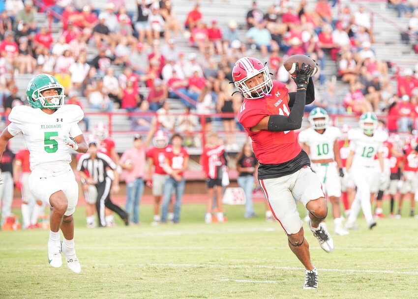 NOTHING BUT HANDS 
Kam Aguero receives a pass from Aaron Segura for the first touchdown of the game against the Eldorado Eagles. In the end, the Broncos left the Eagles in the grass with a 41-0 victory on Friday, September 13th, at Bronco Stadium in Sonora. This week the Broncos will host the Alpine Bucks for their homecoming game on Friday, September 20, 2024.   ANGIE BRYANT | THE DEVIL’S RIVER NEWS