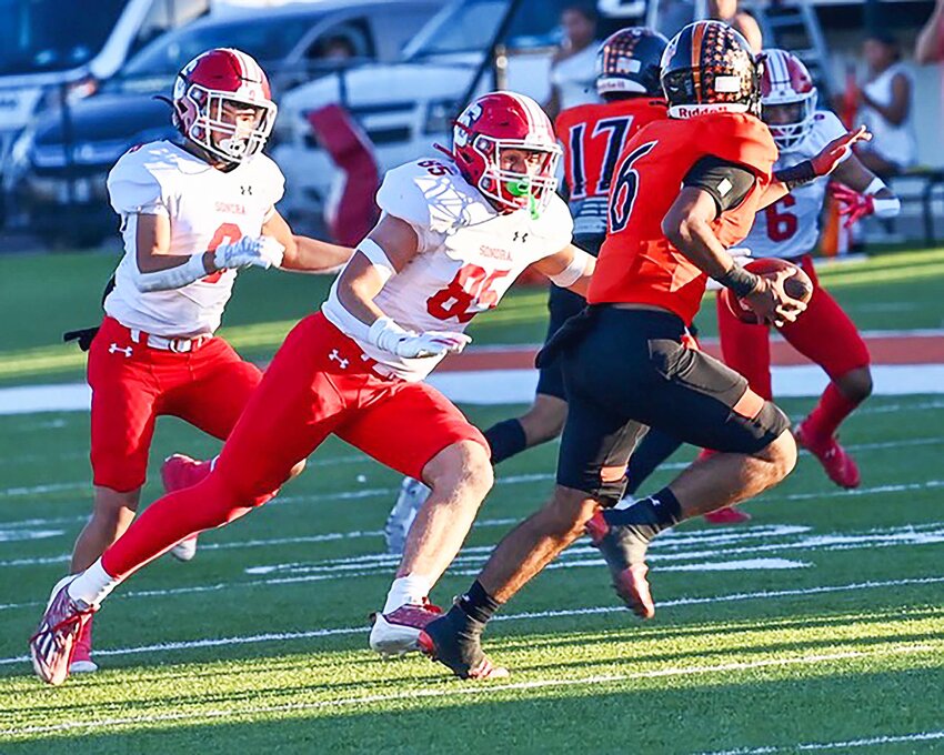 TAKING OUT THE QB
Owen Jones puts pressure on the McCamey quarterback on Friday, September 28, 2024, as they defeated the Badgers 40-14. The Broncos have a bye week this week then will kick off district at home October 11, 2024 at Bronco Stadium. 
NANCY GLASSCOCK| SPECIAL TO THE DEVIL’S RIVER NEWS