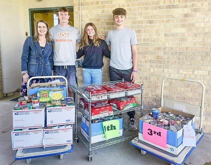 HAVING A HEART FOR OTHERS -- EHS Student Council and National Honor Society representatives Andrew McGee, Micah McGee and Korbin Middleton delivered nonperishable food items collected by SCISD students to the Eldorado Service Center on Monday, November 18th, where they were accepted by Service Center board member Jennifer Henderson. -- KATHY MANKIN | THE ELDORADO SUCCESS