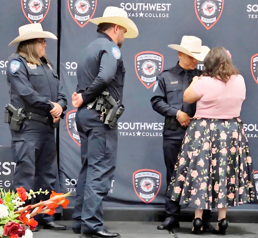 FRESH OUT OF THE ACADEMY
Lt. Whitney Merkett and Chief of Police Donnie Fernandez were present for the swearing in of the newest officer Mario Herrera. His wife, Priscilla, placed the badge on his chest during the graduation and swearing in on Tuesday, May 20, 2025. COURTESY PHOTO